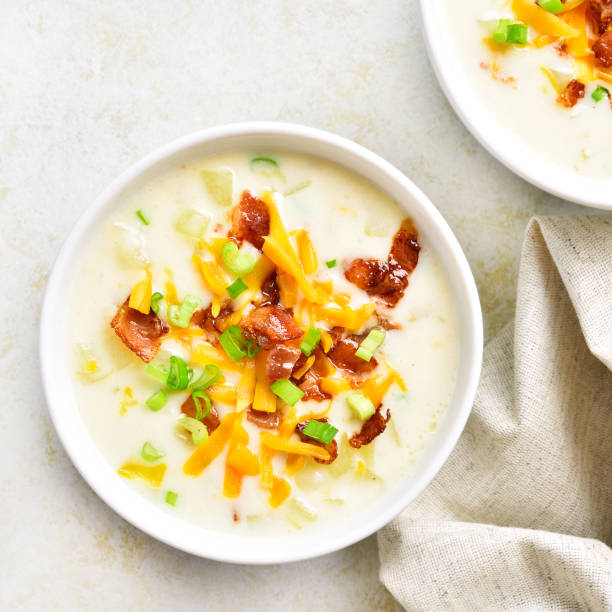 istock Potato creamy soup with bacon and cheddar cheese 1305845600