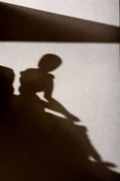 istock Shadow of dummy falls on white wall chiaroscuro contrast drawing 1305846684