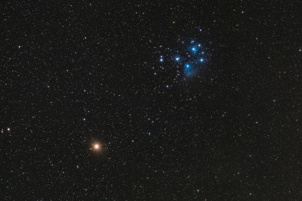 Mars and Pleiades The red planet Mars and the Pleiades in the constellation Taurus, photographed on March 6th, 2021. the pleiades stock pictures, royalty-free photos & images