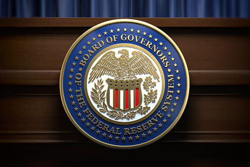 Federal Reserve System Fed sign and symbol on tribune in press conference hall. 3d illustration