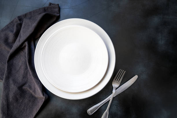 istock White craft plate, cutlery and napkin 1305848972