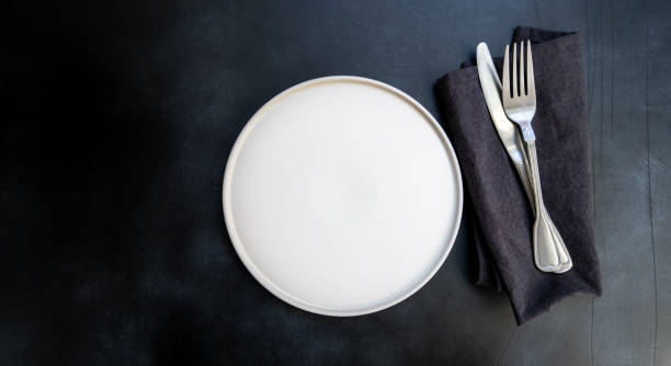 istock White craft plate, cutlery and napkin 1305849395