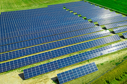 Solar Panels on field. Alternative energy in Poland. Aerial view of nature in Poland