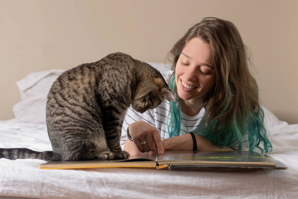 istock girl with cat at home 1305850259