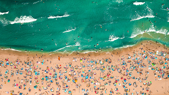 Crowded beach at Baltic Sea. Tourism in Poland. Aerial view