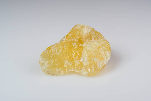 Natural mineral calcite on a white background Natural mineral calcite on a white background calcite stock pictures, royalty-free photos & images