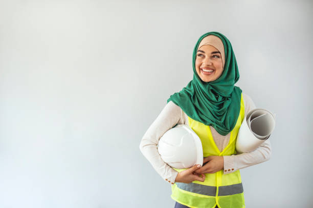 istock Pretty arabic architect woman isolated shot in studio. 1305853404