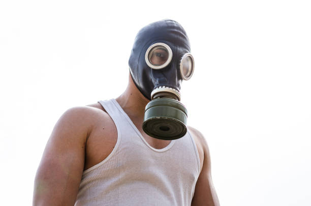 A muscular man in a gas mask. Pademic concept