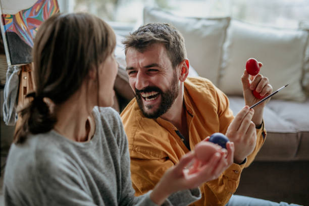 istock Close up image of a smiling couple preparing for a Easter 1305855987