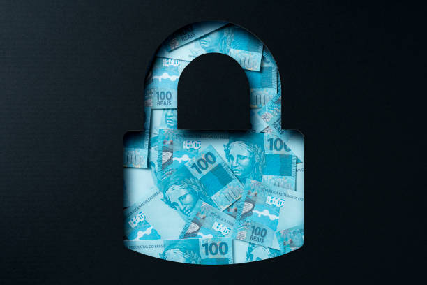 istock Brazilian real heap under paper cutout padlock icon 1305857089