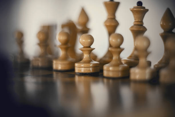 istock White's pieces on the chessboard. 1305859590