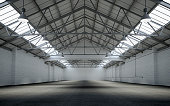 Front view of an empty large warehouse interior