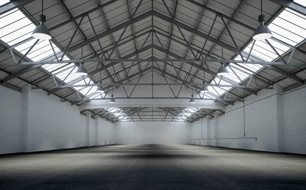 front view of an empty large warehouse interior - nobody old architecture urban scene imagens e fotografias de stock