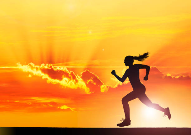 istock Female athlet running at sunset 1305861744