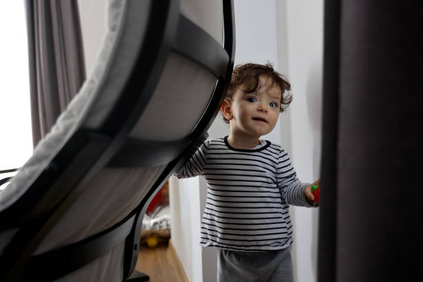 istock Baby girl first steps 1305865977