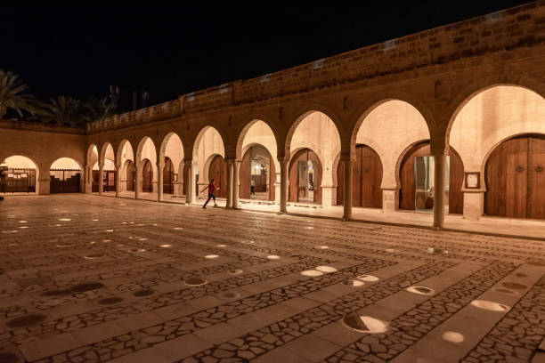 Great Mosque of Sousse in Tunisia. Great Mosque of Sousse in Tunisia. People Shoes in fron of entrance right before evening worship. Friday evening. sousse tunisia stock pictures, royalty-free photos & images