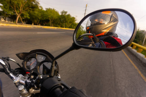 istock Rider driving in the mirror 1305873870