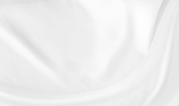istock White gray satin texture that is white silver fabric silk background with beautiful soft blur pattern natural. 1305879765