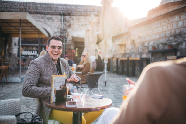 istock Smiling businessman drinking coffee 1305880648