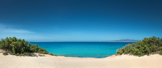 Idyllic remote wild sand beach on Naxos island, Greece.