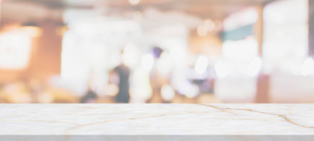 istock marble table top with blurred abstract cafe restaurant interior background 1305883599