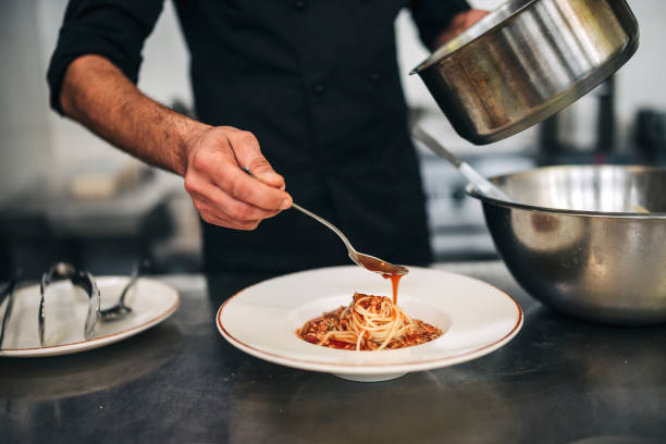 istock Male chef prepare pasta in restaurants kitchen 1305883832