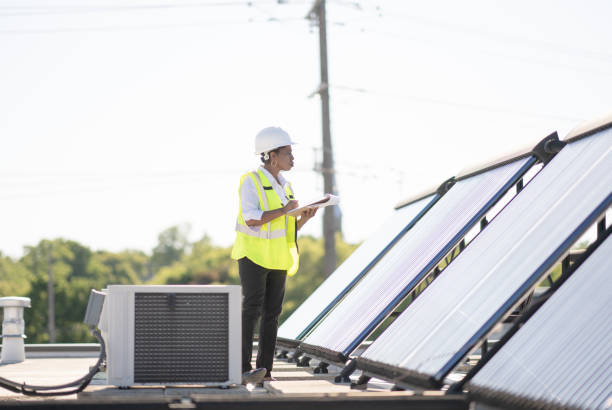 istock Female Engineer Working With Solar Panels Stock Photo 1305883925