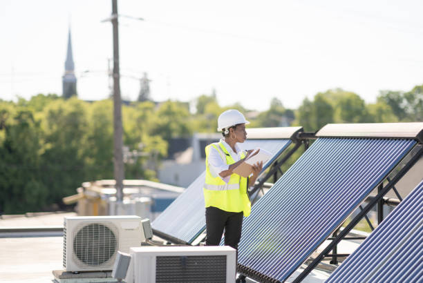 istock Female Engineer Working With Solar Panels Stock Photo 1305883993