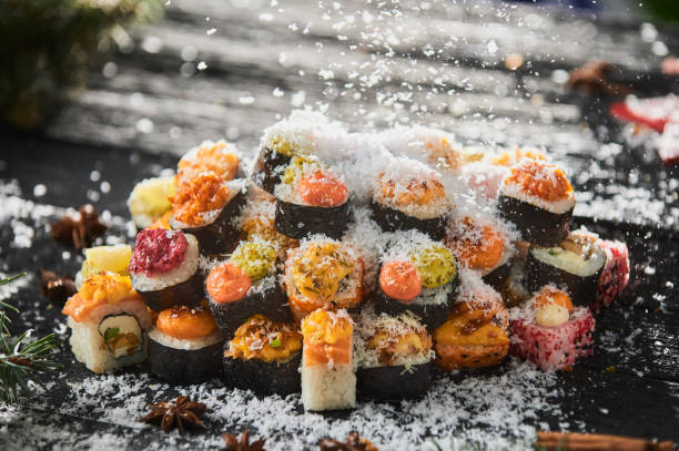 istock sushi set and sushi roll on wooden board. 1305884217