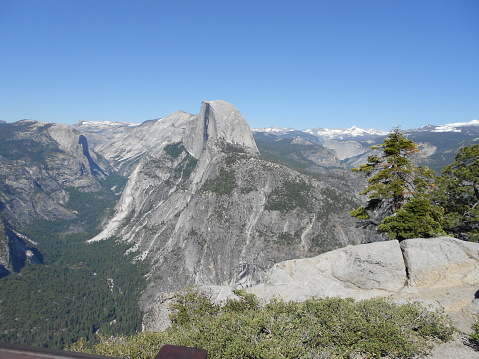 View of Half Dome and surrounding Sierra Nevada mountains from the summit of Sentinel Dome