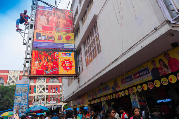 Kolkata, West Bengal, India - 10th September 2019 : Movie goers outside Lighthouse cinema hall, one of the oldest cinema halls at Esplanade, New Market area, Kolkata.
