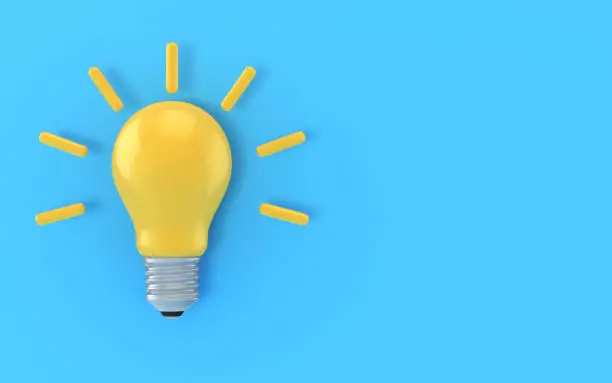 Photo of Yellow Light Bulb Icon on blue background stock photo