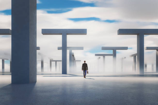 istock Businessman walking in concrete maze 1305893775