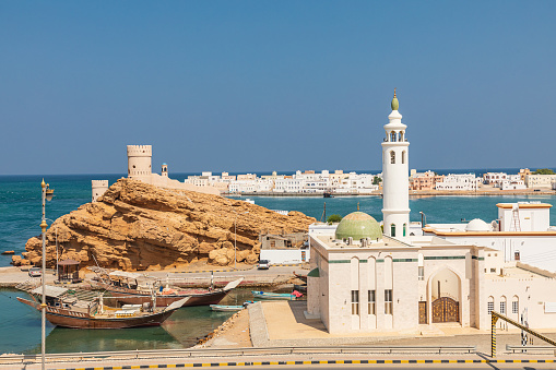 Middle East, Arabian Peninsula, Oman, Al Batinah South, Sur. Small mosque on the harbor in Sur, Oman.
