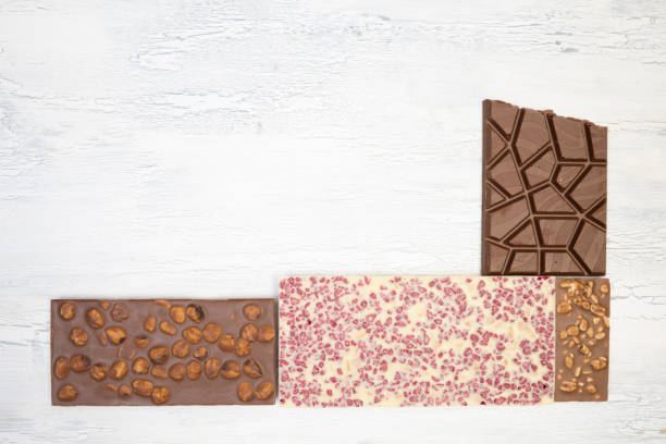 istock many different sweet, delicate chocolate bars lie creatively on a white wooden background