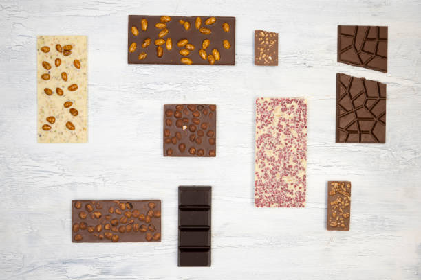 istock many different sweet, delicate chocolate bars lie creatively on a white wooden background