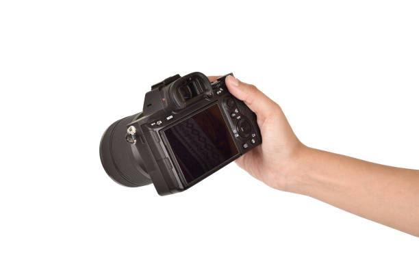 istock Digital camera in hand isolated on white background with clipping path 1305897041