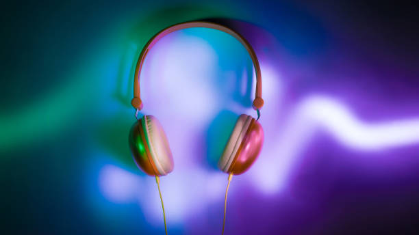 istock Headphones in dark with neon light audio graph 1305898722