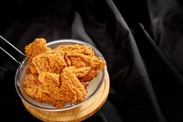 istock crispy fried chicken in a black luxury satin background 1305900279