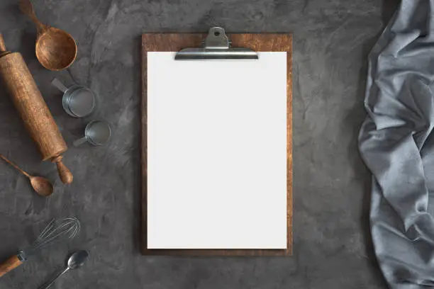 Photo of Menu mockup with knife and fork on a Concrete background, Free space for your text