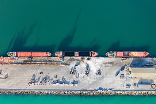 Drone Point View of Cargo Ship in the Port. Aerial view of Coal Ship in a port.