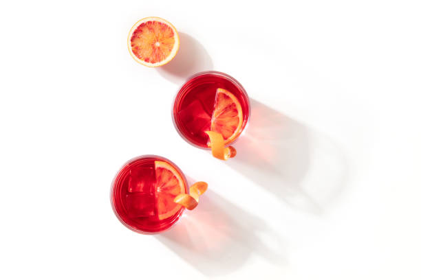 Negroni cocktails with blood oranges, overhead flat lay shot stock photo