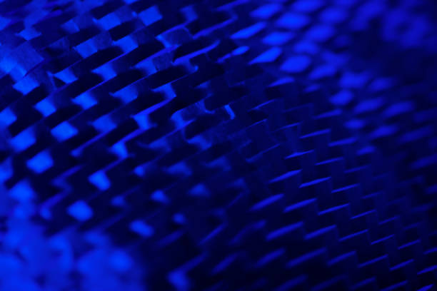 Modern abstract pattern of recycled packing paper lit with blue light.