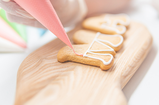 High angle view of homemade gingerbread Christmas cookies shot on white background. High resolution 42Mp studio digital capture taken with SONY A7rII and Zeiss Batis 40mm F2.0 CF lens