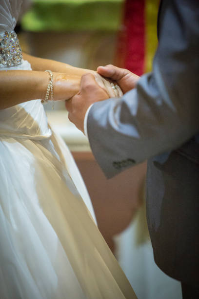 istock hands of the bride and groom 1305908821