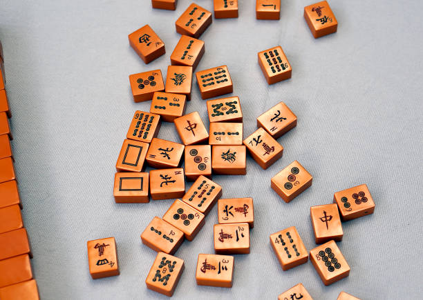 istock Old Mah Jongg tiles on a tabletop 1305912528