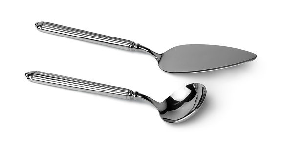 Silver cake shovel and spoon isolated on white background close up