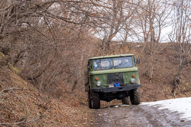 istock Old truck on a dirt mountain road 1305913677