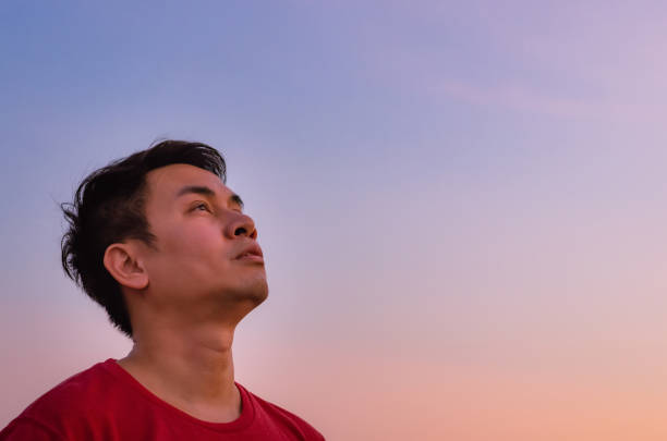 istock Asian man looking up to sky. 1305913807