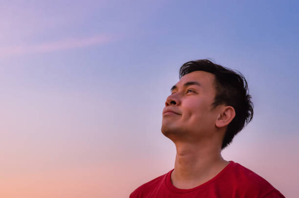 istock Asian man looking up to sky. 1305913808